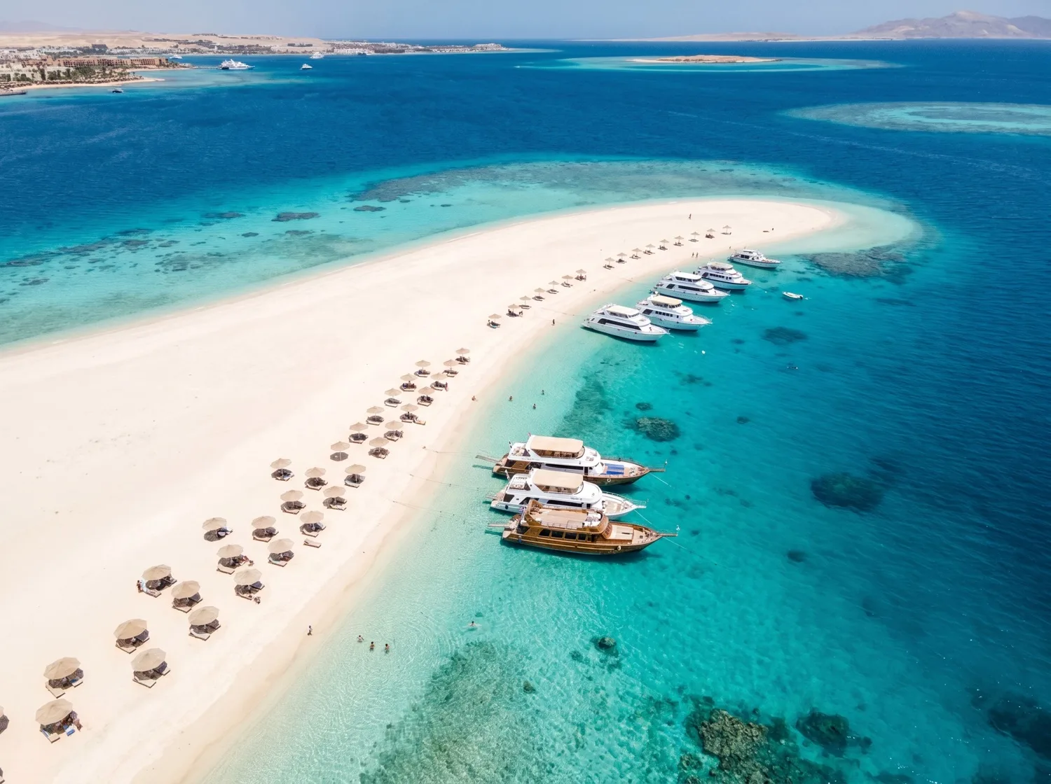 The long white sandbank of Orange Bay reaching into shallow turquoise water near Hurghada